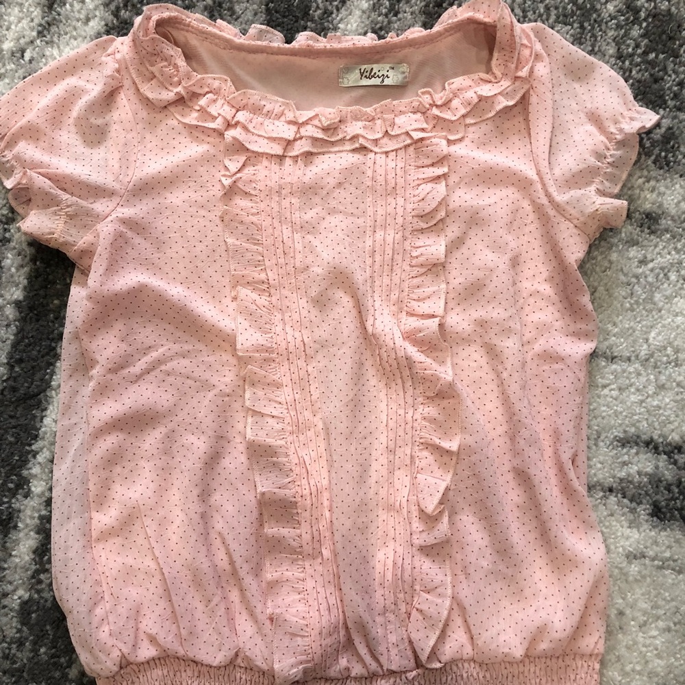 Pink polka dot blouse. Color is baby pink